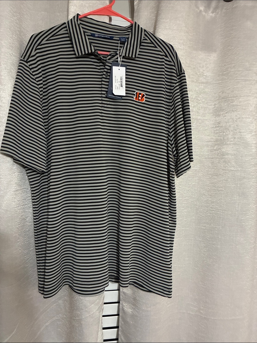 Men's Black and White Striped Polo with Team Patch